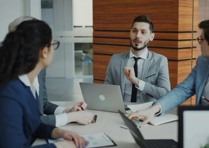 Business people collaborating in a modern office meeting.